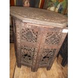 Heavily carved blackwood Oriental octagonal topped table
