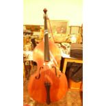 Modern double bass with bow and metal stand, the inner label ex.