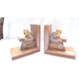 Pair of oak bookends each in the shape of a book together with seated elders