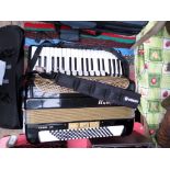 Modern Hohner 22 key accordion in black canvas carrying case