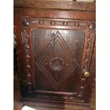 Early carved oak free standing shelved cupboard