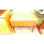 Mahogany rectangular topped double gateleg tea table on plain feet on casters,