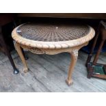 Ornate circular glass and basket weave top sidetable on ornate ball and claw feet (33" dia)