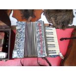 24 key Accordion in decorative mottled grey and black case ex.