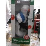 Unused boxed Christmas decoration of spinning snowflake snowman