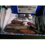 Man Tin including a selection of pocket knives, screw set in leather pouch,