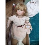 Pot headed doll, fixed blue eyes, loose limbs,