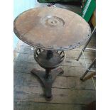 Circular topped drinks table on tricorn base with undershelf fitted raised gallery