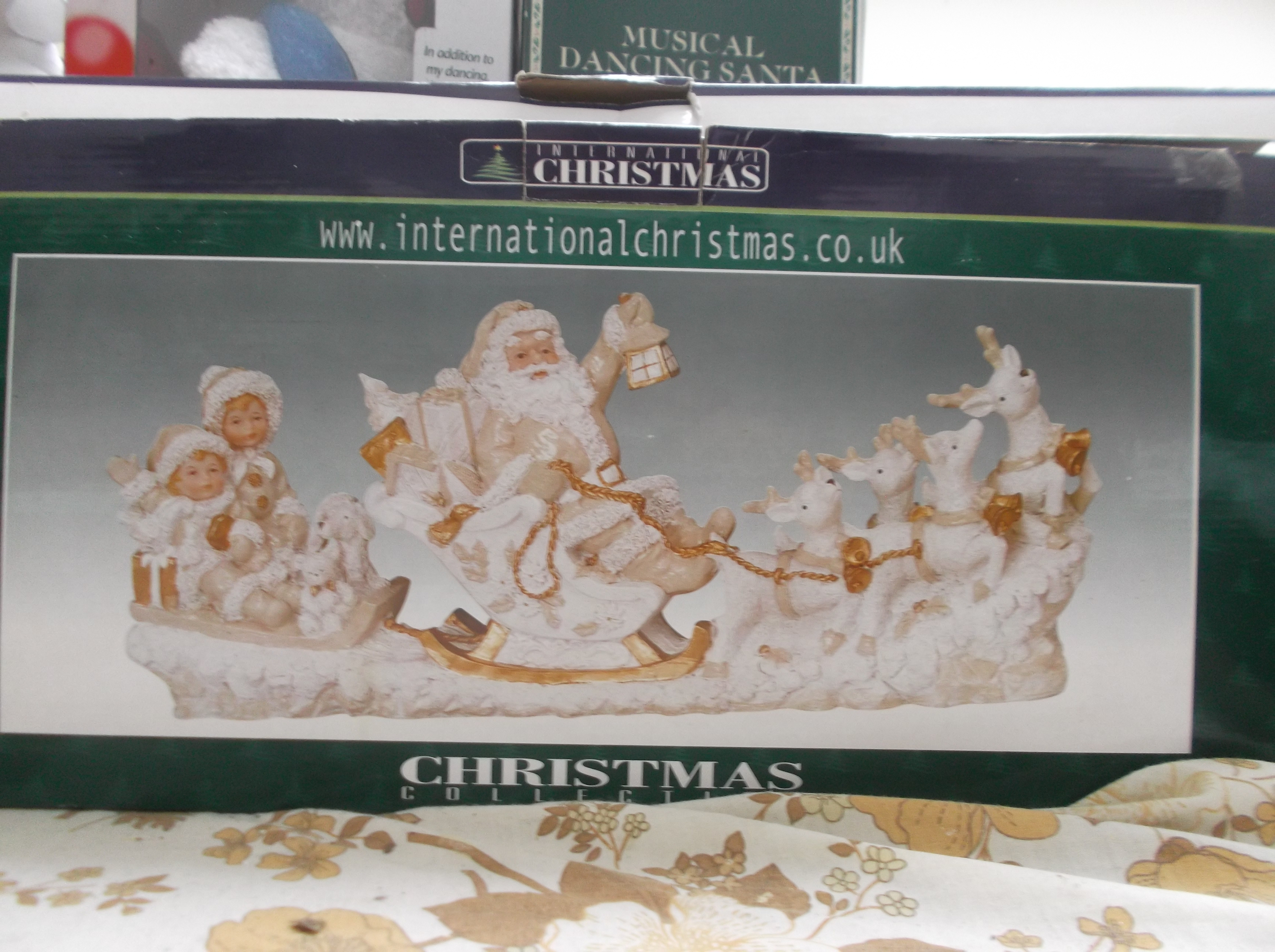 Boxed Christmas International model of Santa with sleigh