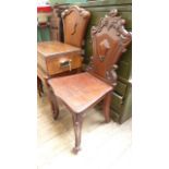 Victorian mahogany hall chair on cabriole legs an ornately carved shaped back