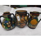 Jug vase and 2 other vases each with multi-coloured Harlequin decoration