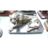 Bronze figure of a resting Jaguar on black rectangular oval plinth