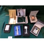 Selection of 5 mint cigarette lighters and 2 cigarette cases in original boxes