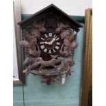 Valuable black forest cuckoo clock with intricate carving of a Fox and grape leaf garland