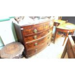 Figured mahogany bow fronted chest of two short and three graduated drawers each with brass garland