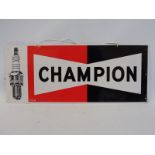 A Champion part pictorial tin advertising sign, 23 x 9 1/2".