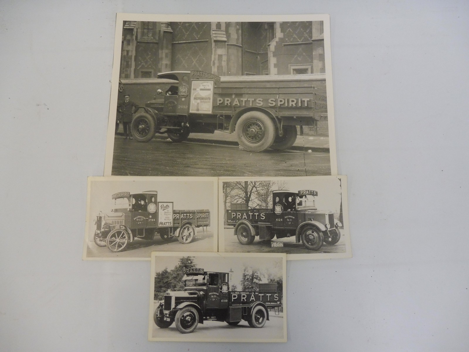 Four black and white photographs depicting early fuel tankers, all in Pratts livery.