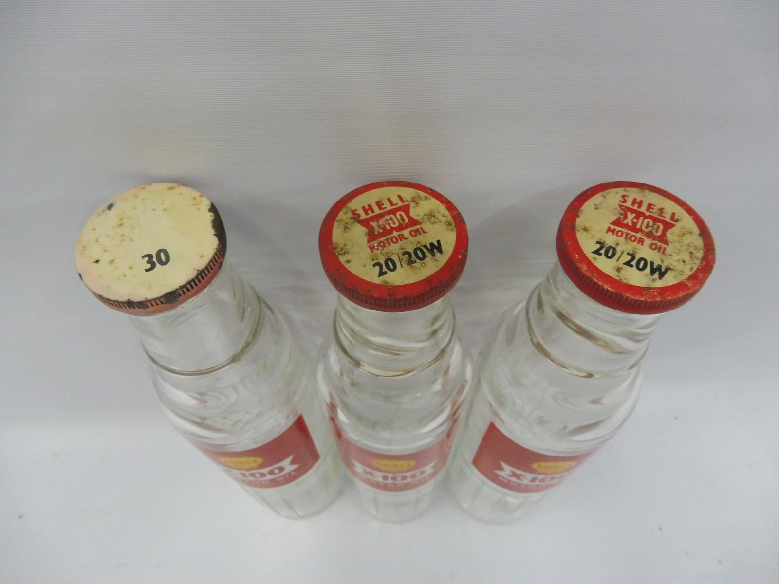 Three Shell X-100 pint oil bottles with tops. - Image 2 of 2