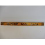 A Dunlop Tool Bags advertising shelf strip.