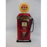 A novelty telephone stylised as an American gasoline pump.