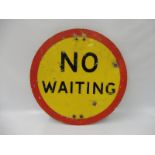 A No Waiting circular yellow and red road sign with partial bracket to the rear, 20" diameter.