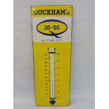 A Duckham's 20-50 Motor Oil enamel thermometer, in very good condition, 12 x 36".
