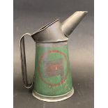 A Wakefield Castrol Motor Oil quart measure, red circle logo version, dated 1949.