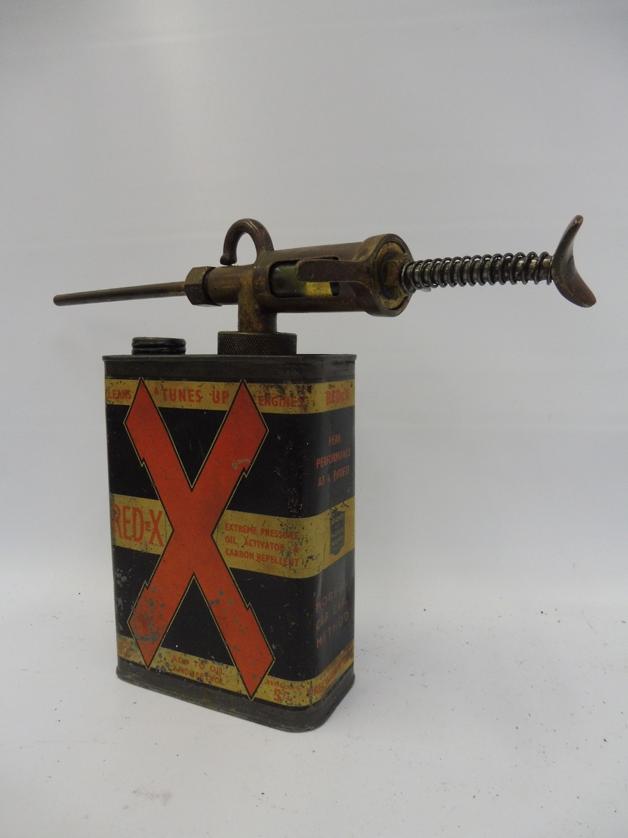 A Redex rectangular quart oil can with dispensing gun.