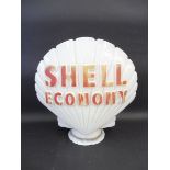 A Shell Economy glass petrol pump globe by Hailware, chips to neck and faded.