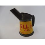 A Shell Motor Oil half pint oil measure in excellent condition, dated 1949.