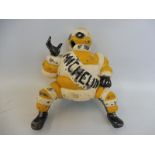 A Michelin cast iron Mr Bibendum figure that would have been fitted on a trolley air pump