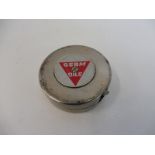 A Germ Oils metal tape measure.