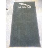 A Jaguar showroom mat, 31 1/2 x 59".