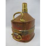 A Chekpump one gallon copper and brass mounted measure.