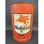 A Mobiloil five gallon oil drum.