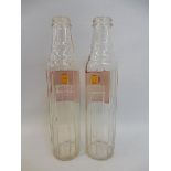 Two Shell X-100 glass oil bottles.