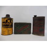 An XL Motor Oil tin, a Whites electrine lamp oil can and a Mustikon tyre repair outfit tin.