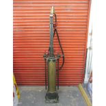 An unusual and early hand operated 5 gallon petrol pump of large size, with tall central brass