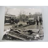 A large scale black nd white photograph of a crash scene where an Austin Sheerline had crashed