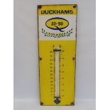 A Duckhams 20-50 enamel thermometer by Burnham, 13 x 36".