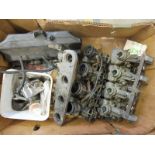 A box containing two banks of four Dellorto carburettors and spares.