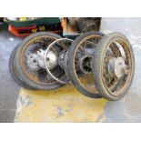 An assortment of motorcycle wheels.