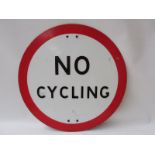 A No Cycling circular embossed road sign in good condition, 18" diameter.