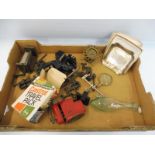 A box of assorted items to include a miniature bench vice, Castrol merchandise etc.