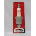 A Champion spark plugs 3D advertising sign, 10 1/2 x 25 1/2".