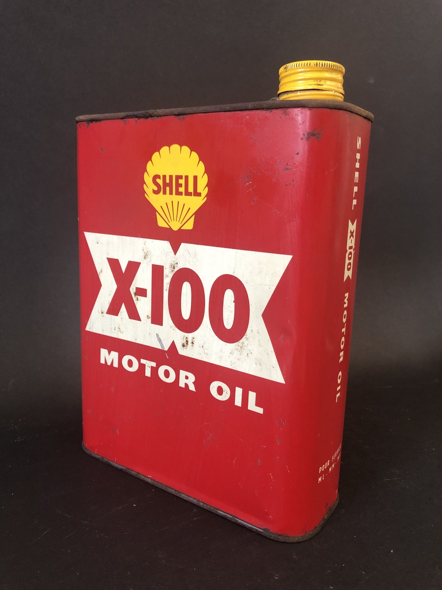 A Shell X-100 Motor Oil rectangular can.