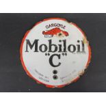 A circular Mobiloil 'C' double sided enamel cabinet/tank indicator, some retouched lettering to