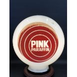 A Pink Paraffin glass petrol pump globe by Hailware, damage to neck.