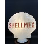 A Shellmex glass petrol pump globe by Hailware, faded lettering and minor nicks to neck.