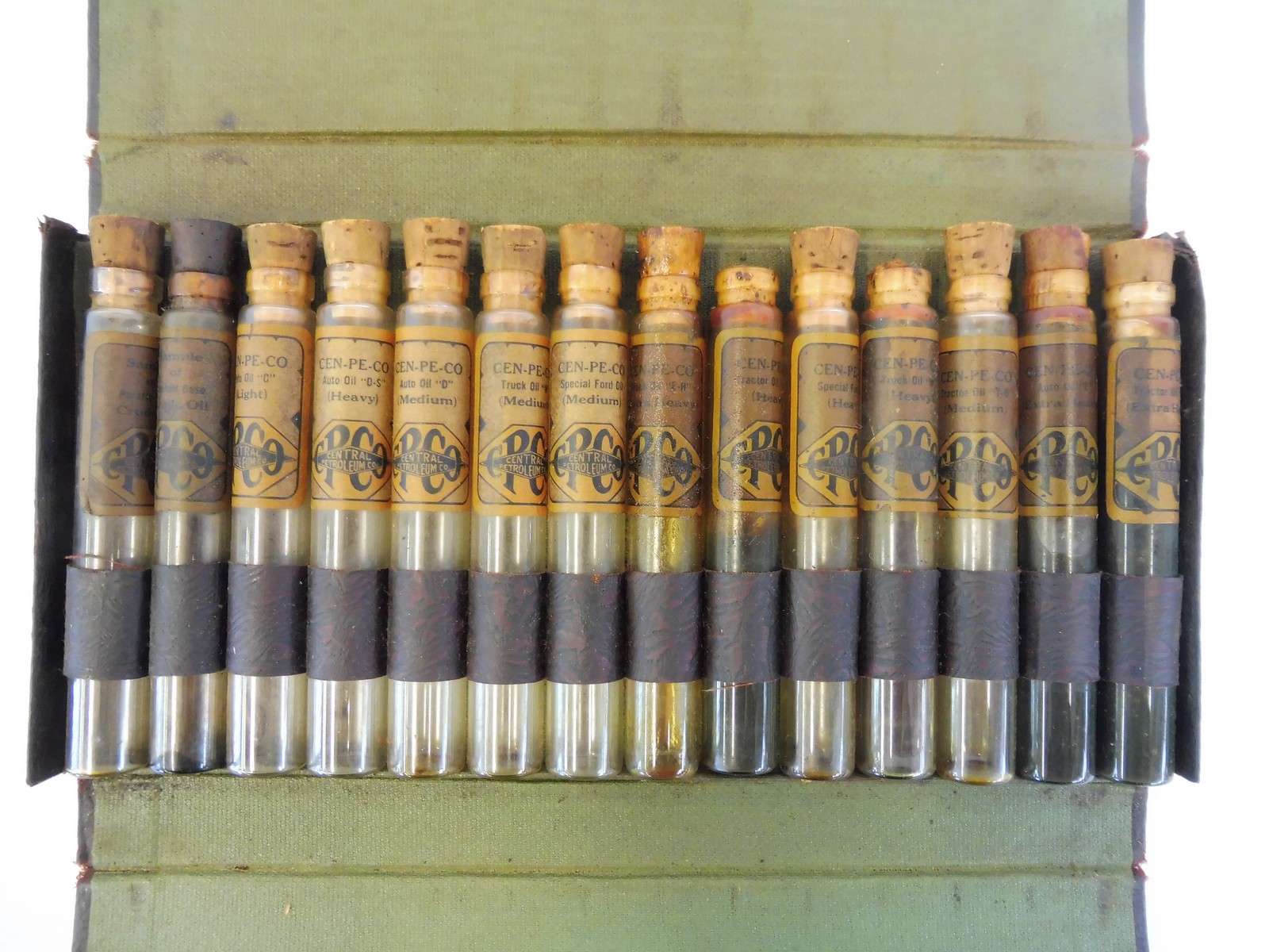 A very early Central Petroleum Company salesman's sample set of 14 viles with original labels, in - Image 2 of 6